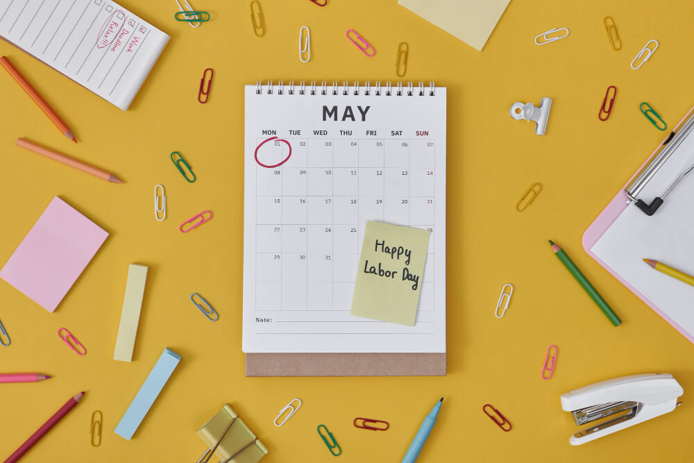 A **calendar** on a yellow background with sticky notes on it.